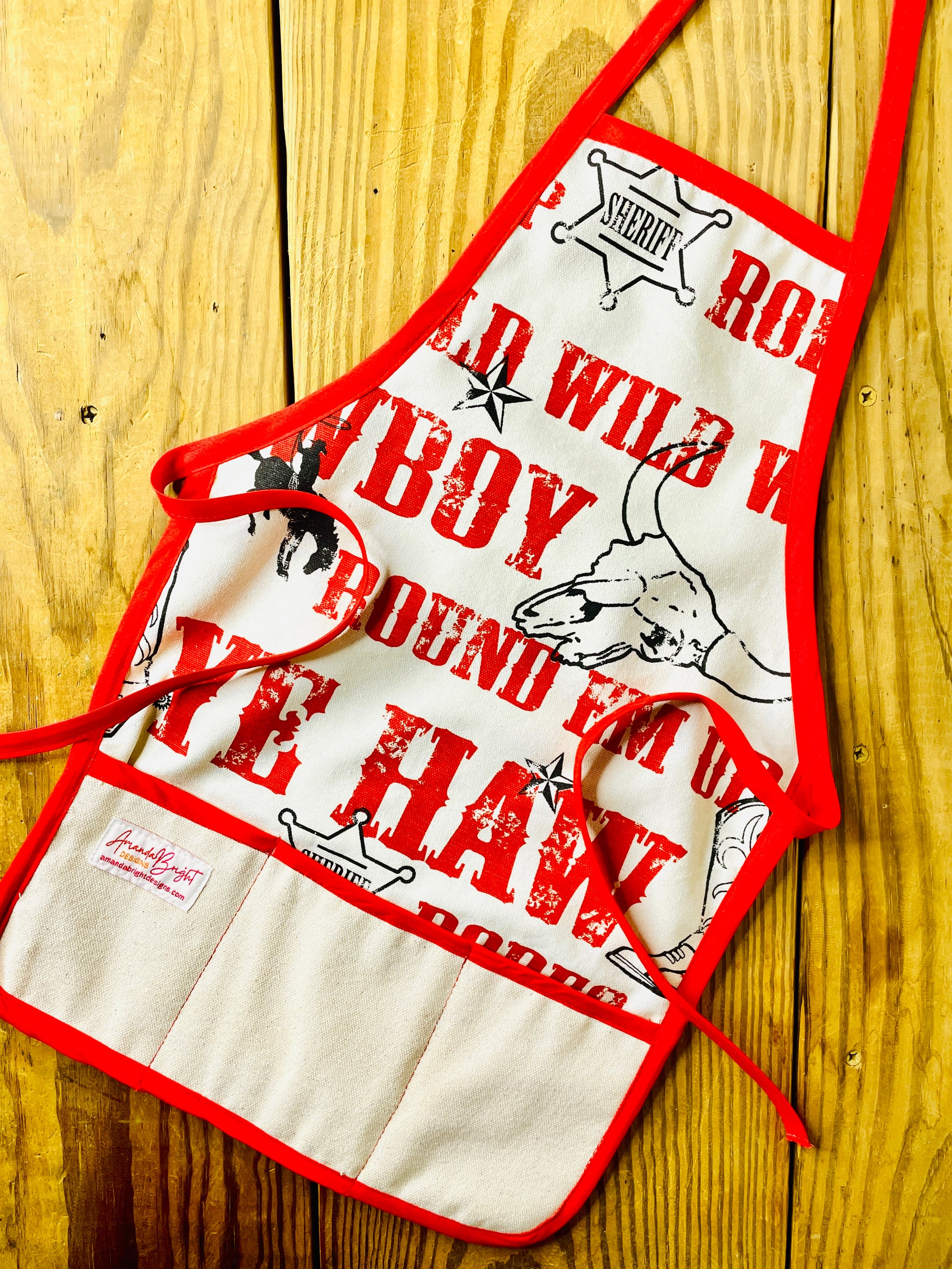 Amanda Bright Designs Jane Apron Children's Cowboy Print Giddy Wild West Horse Spurs Boots with Red Apron Strings and Three Pockets