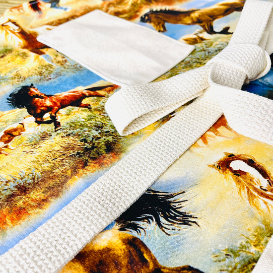 Two Medium Sized Ladies Hadleigh Apron Wild Horses American Southwest Wild West Apron Pattern close up view