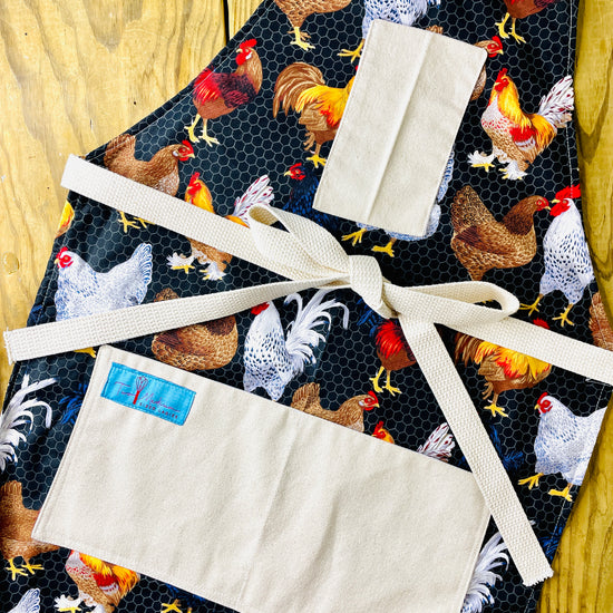 Two Medium Sized Ladies Kathleen Apron chickens wire coop raising farm