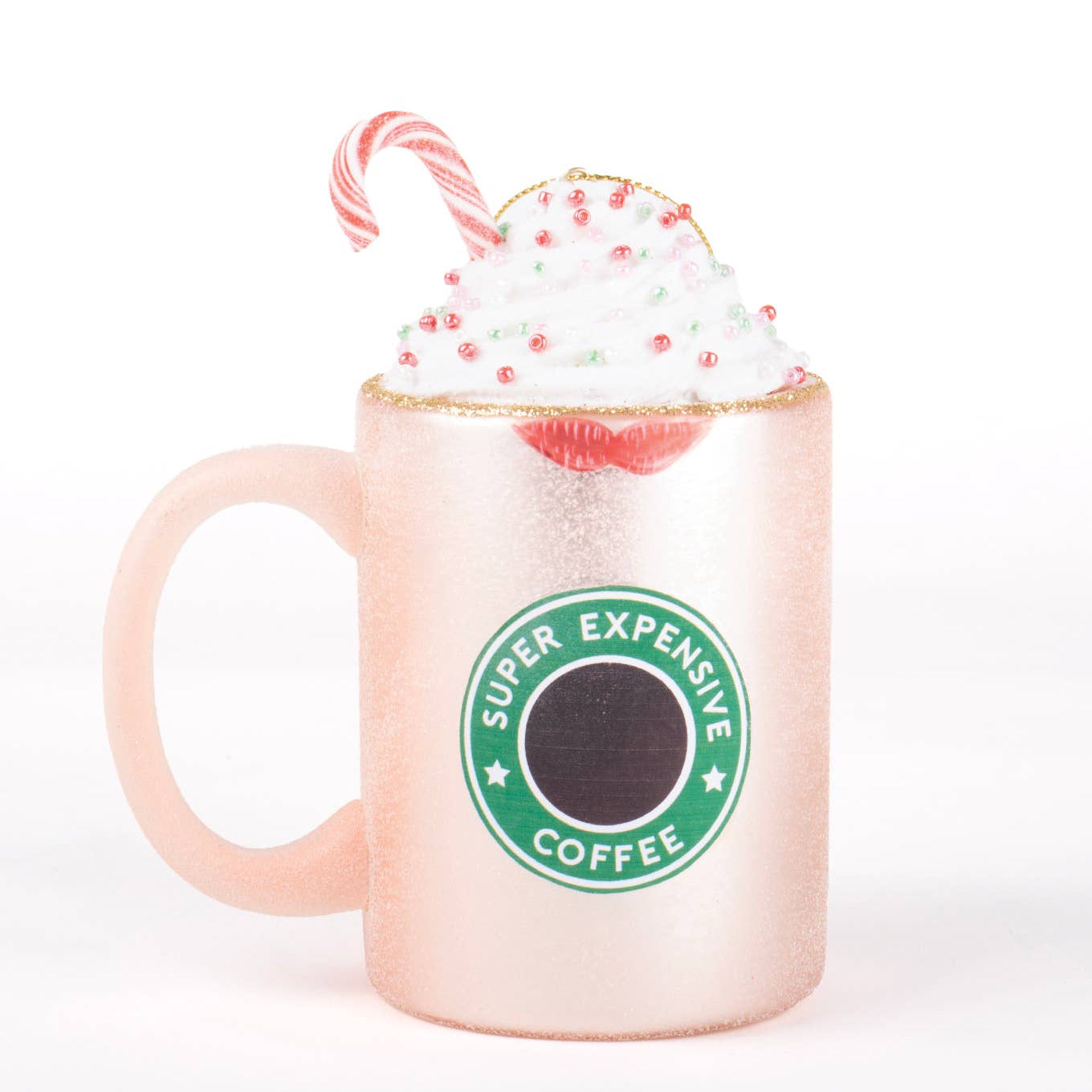 Pink mug with 'Super Expensive Coffee' logo, whipped cream, and candy cane on a white background