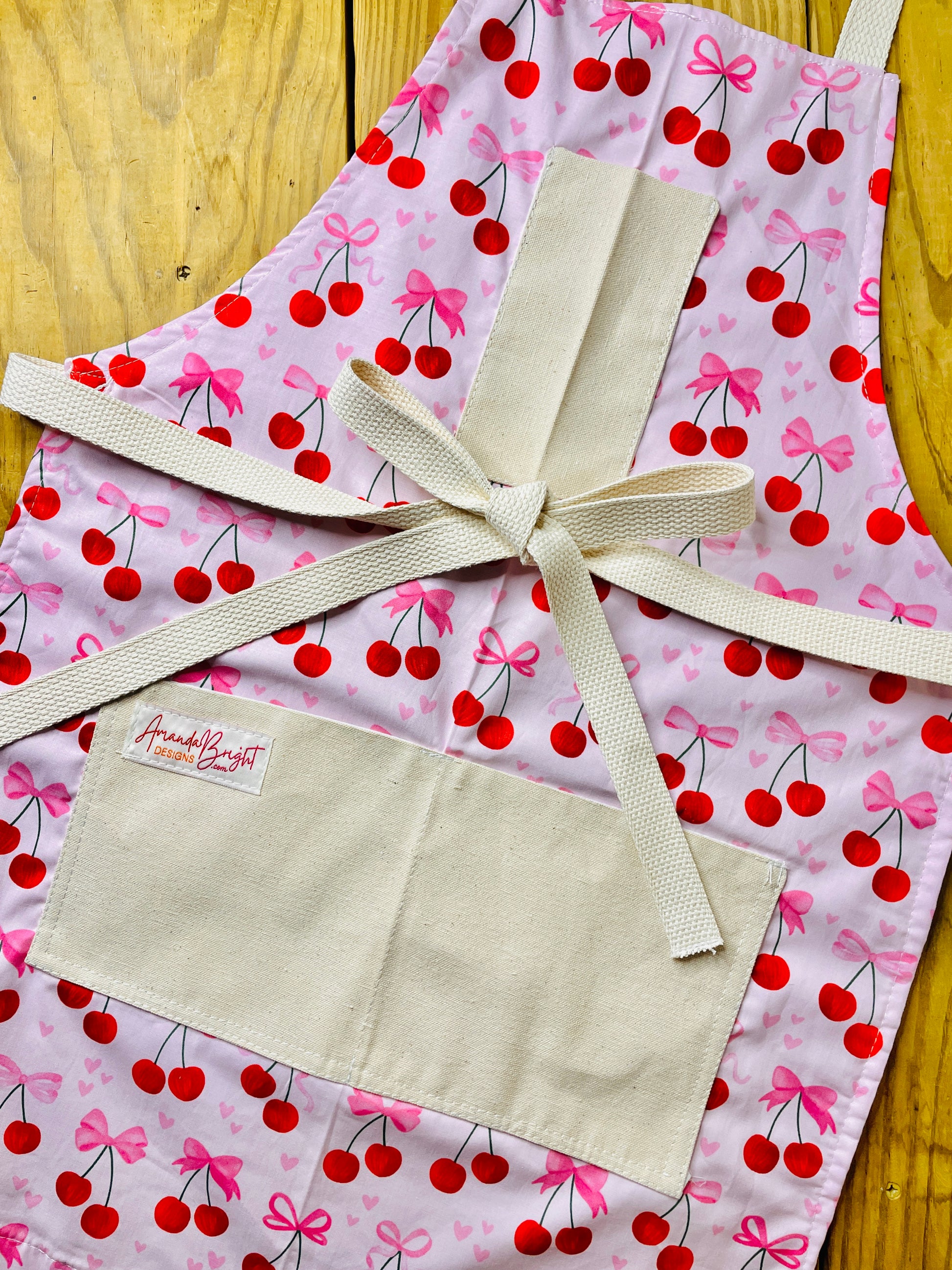 Amanda Bright Designs Pink Bows and Cherries Apron with pink hearts