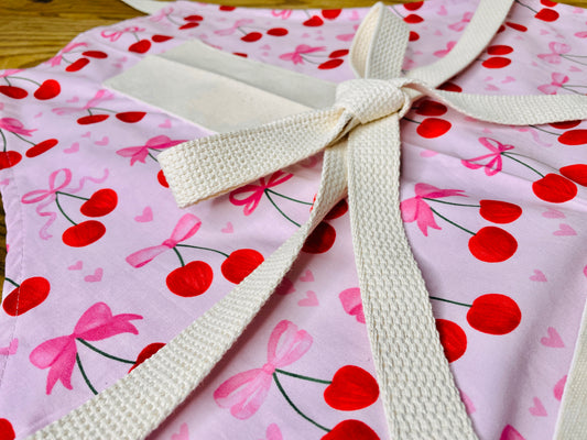 Amanda Bright Designs Pink Bows and Cherries Apron with pink hearts