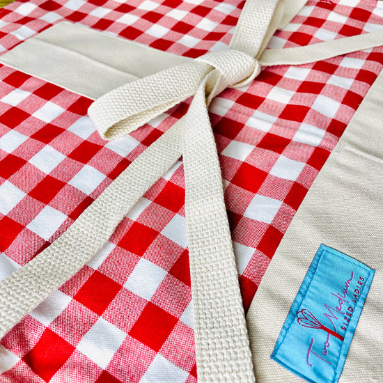 Wendy red checkered gingham apron tablecloth summer picnic Italian French bbq close up view