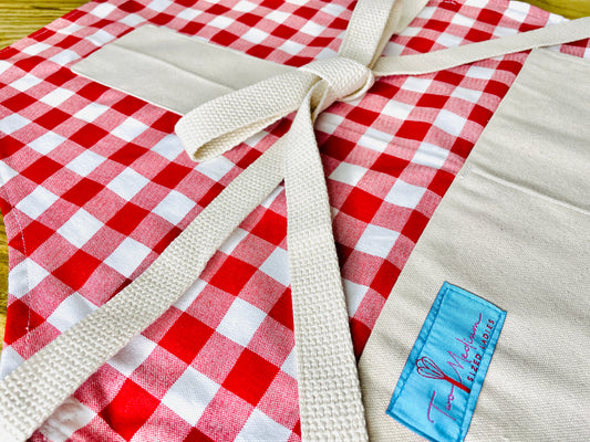 Wendy red checkered gingham apron tablecloth summer picnic Italian French bbq close up view