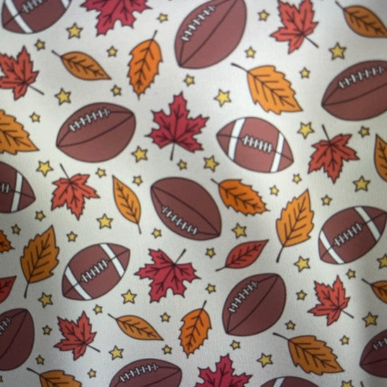 Footballs Fall leaves and stars on a cream background Sunday Apron Amanda Bright Designs Couture Collection