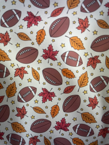 Footballs Fall leaves and stars on a cream background Sunday Apron Amanda Bright Designs Couture Collection