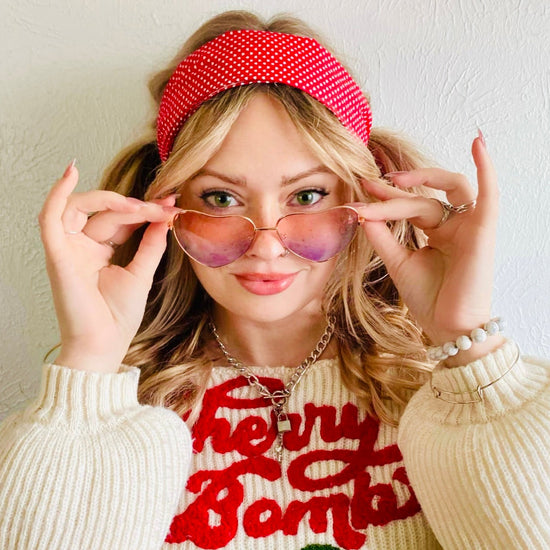 woman with red swissdot headband wearing sweater with cherries Amanda bright designs