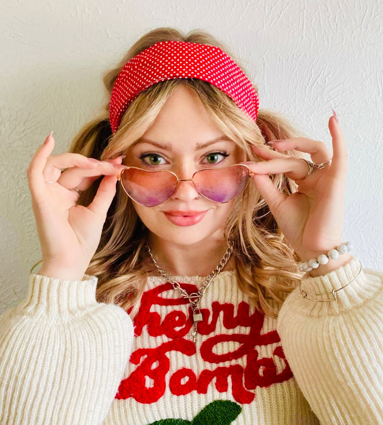 woman with red swissdot headband wearing sweater with cherries Amanda bright designs