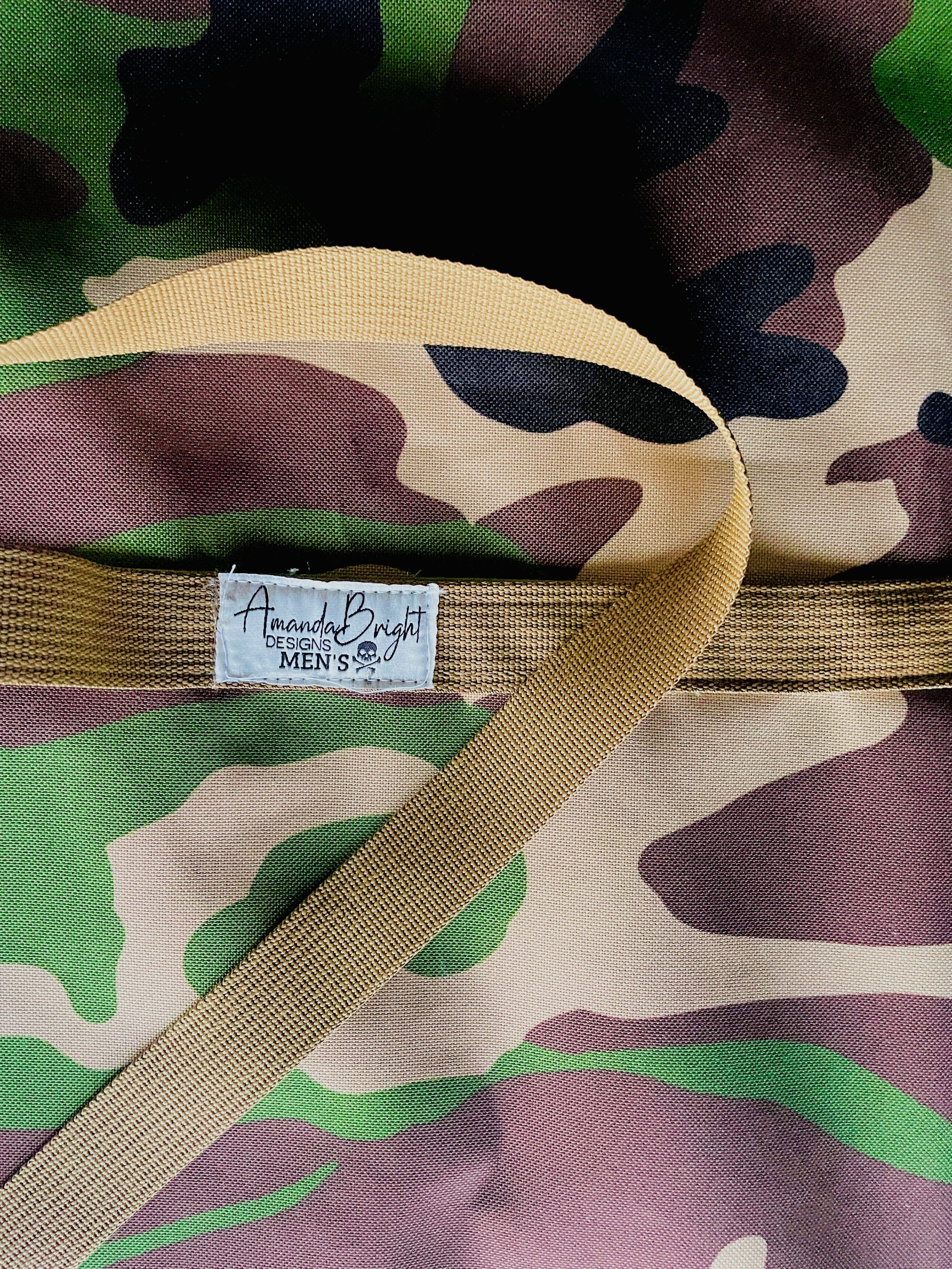 Amanda Bright designs the Rambo camouflage ottertex waterproof apron with coyote brown strings