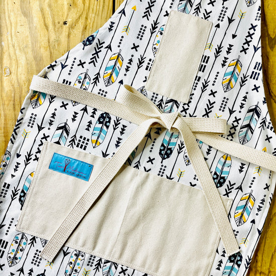 Two Medium Sized Ladies Candace hippie boho style kitchen baking cooking gardening apron feathers and arrows navy blue and gold