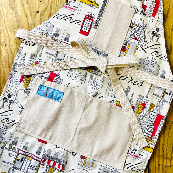 Two Medium Sized Ladies Evelyn Apron London New York City Paris skyscrapers cafe streets cityscape icon midcentury travel apron