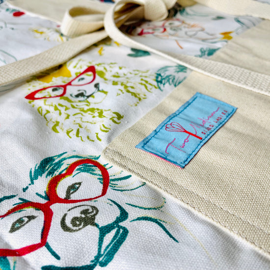 Two Medium Sized Ladies Iris Apron Dogs wearing glasses fashion fun colorful apron closeup view