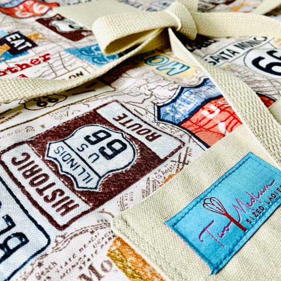 Two Medium Sized Ladies Rhonda Road Trip Route 66 Apron Collection American car travel highway signs map diner Santa Monica California History Kitchen Apron close up view