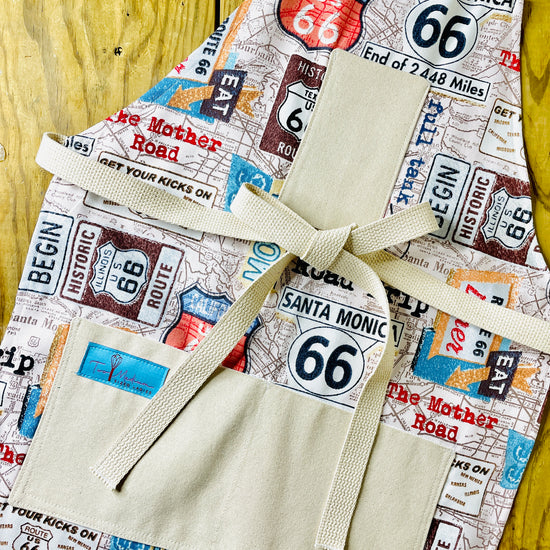 Two Medium Sized Ladies Rhonda Road Trip Route 66 Apron Collection American car travel highway signs map diner Santa Monica California History Kitchen Apron