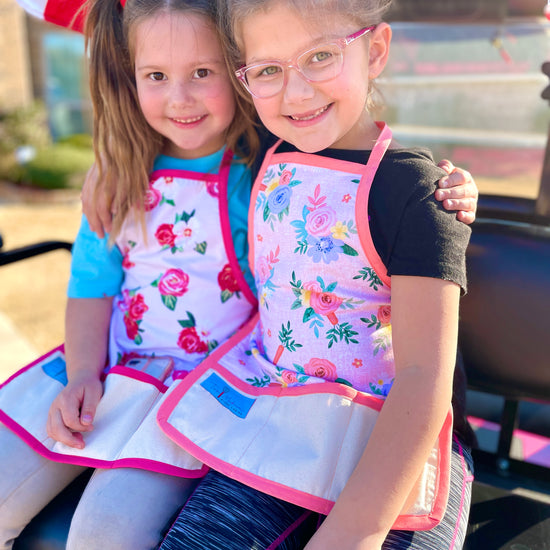 Two Medium Sized Ladies easter flowers roses easter bunny carrots childrens kids apron peach trim mommy and me style friends little girls